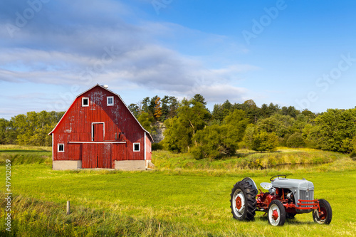 Photo: Traditional American Red Barn With Vintage Tractor Traditional American Red Barn With Vintage Tractor