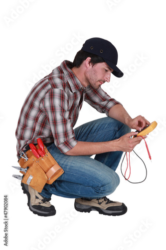 Photo: Electrician with multimeter Electrician with multimeter