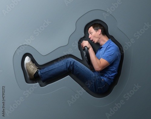 Photo: Funny car driver in a stylized toy package, artistic concept Funny car driver in a stylized toy package, artistic concept