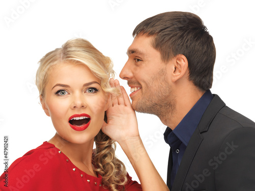 Photo: man and woman spreading gossip man and woman spreading gossip