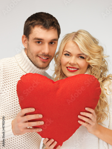 Photo: family couple in a sweaters with heart family couple in a sweaters with heart