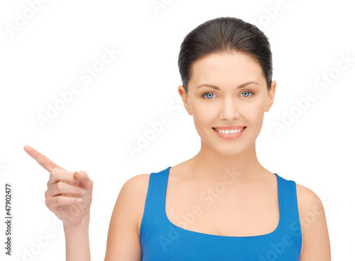Photo: beautiful woman pointing her finger beautiful woman pointing her finger