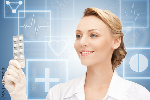 Photo: attractive female doctor with pills attractive female doctor with pills