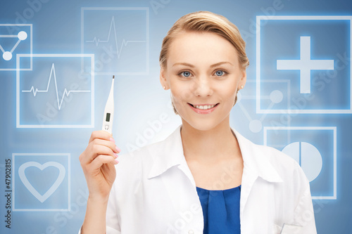 Photo: attractive female doctor with thermometer attractive female doctor with thermometer