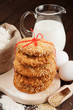 Foto: holiday cookies with red ribbon, flour, milk jug and eggs on kit holiday cookies with red ribbon, flour, milk jug and eggs on kit