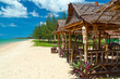 Tropical beach scenery with huts in Thailand
