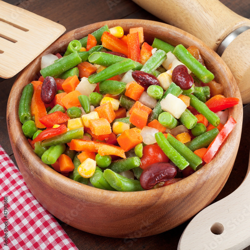 Photo: mixed vegetables in wooden bowl mixed vegetables in wooden bowl