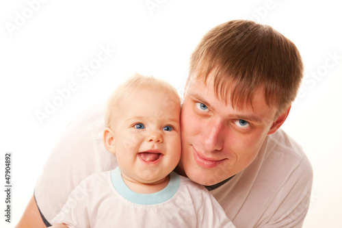 Photo: Father and baby. Isolated on white background Father and baby. Isolated on white background