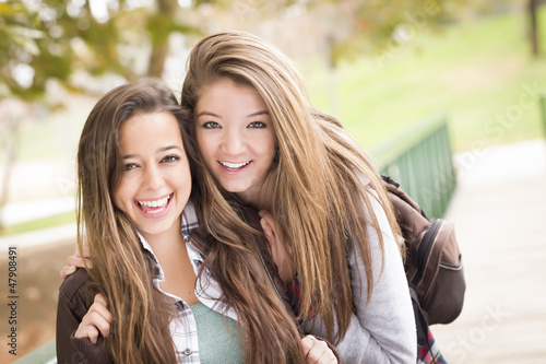 Photo: Mixed Race Women Pose for a Portrait Outside Mixed Race Women Pose for a Portrait Outside