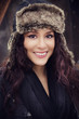 Portrait of smiling young woman in hat