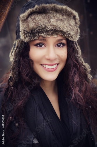 Photo: Portrait of smiling young woman in hat Portrait of smiling young woman in hat