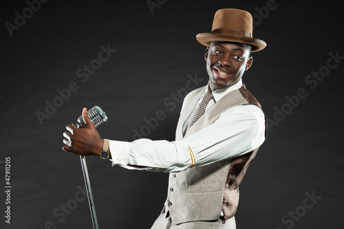 Photo: Black american jazz singer. Vintage. Studio shot. Black american jazz singer. Vintage. Studio shot.