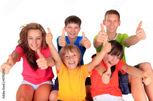 Photo: Teens and kids with thumbs up Teens and kids with thumbs up