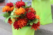 Green gift bags with silk flowers