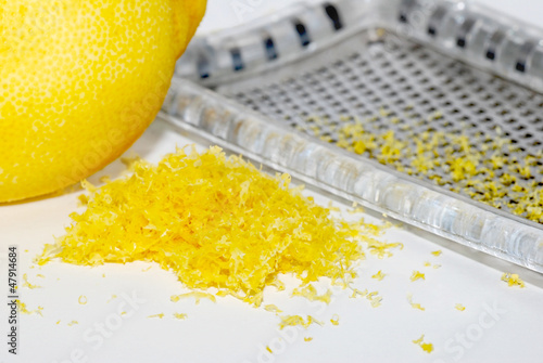 Photo: Grated lemon zest with the fruit and grater Grated lemon zest with the fruit and grater