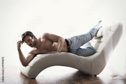 Photo: Young muscular man in a sexy pose Young muscular man in a sexy pose
