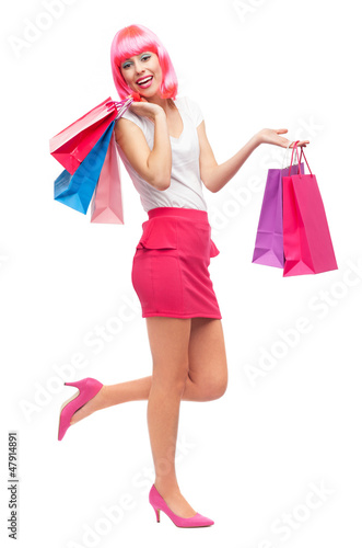 Photo: Happy young woman with shopping bags Happy young woman with shopping bags