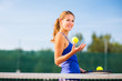 Portrait of a pretty young tennis player with copyspace