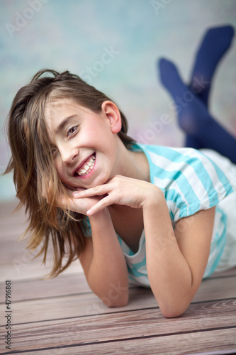 Photo: Happy young girl enjoying spare time Happy young girl enjoying spare time