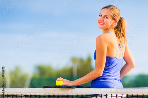 Photo: Portrait of a pretty young tennis player with copyspace Portrait of a pretty young tennis player with copyspace
