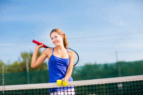 Photo: Portrait of a pretty young tennis player with copyspace Portrait of a pretty young tennis player with copyspace
