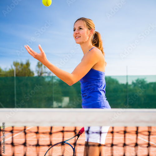 Photo: Portrait of a pretty young tennis player Portrait of a pretty young tennis player