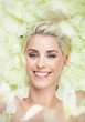 Attractive short-hair woman among white petals