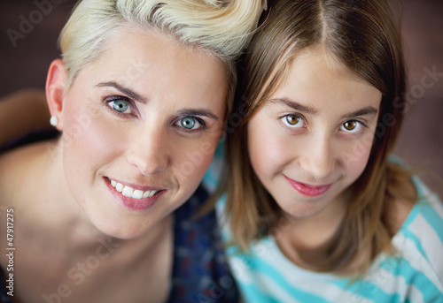Photo: Smiling blonde woman with daughter Smiling blonde woman with daughter