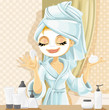 Cute girl with a cosmetic mask on her face in the bathroom