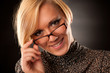 Beautiful young blonde with eyeglasses isolated 