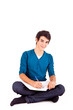 Young happy student carrying books