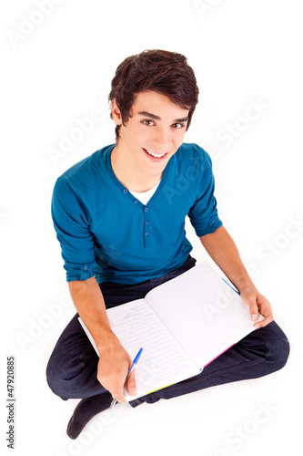 Photo: Young happy student carrying books Young happy student carrying books