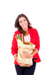 Young female holding a shopping bag on white background