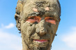 Man smeared with healing mud