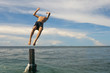 Back dive in Turquoise Tropical Polynesian Paradise Beach
