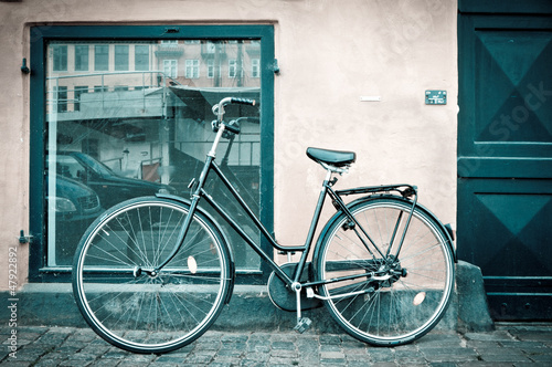 Photo: Classic vintage retro city bicycle in Copenhagen, Denmark Classic vintage retro city bicycle in Copenhagen, Denmark