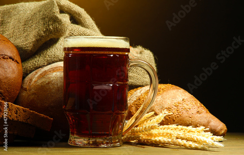 Photo: tankard of kvass and rye breads with ears, tankard of kvass and rye breads with ears,