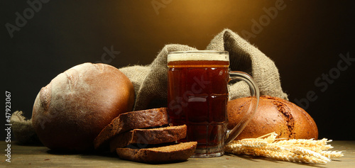 Photo: tankard of kvass and rye breads with ears, tankard of kvass and rye breads with ears,