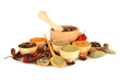 wooden mortar, bowls and spoons with spices isolated on white