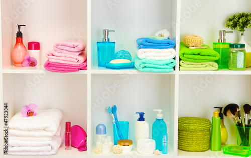 Photo: Bath accessories on shelfs in bathroom Bath accessories on shelfs in bathroom