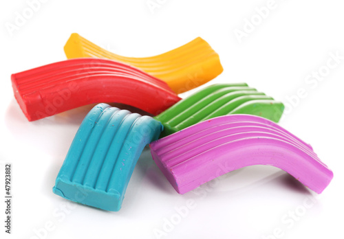 Photo: Children bright plasticine isolated on white Children bright plasticine isolated on white