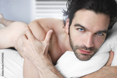 Photo: Portrait of a sexy nude man in bed Portrait of a sexy nude man in bed