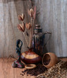 still life with a carving statue of an african woman