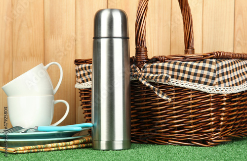 Photo: metal thermos with cups, plates and basket metal thermos with cups, plates and basket