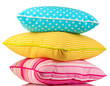 Blue, pink and yellow bright pillows isolated on white