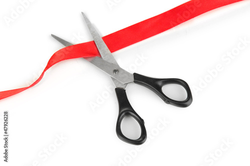 Photo: Cutting red ribbon isolated on white Cutting red ribbon isolated on white