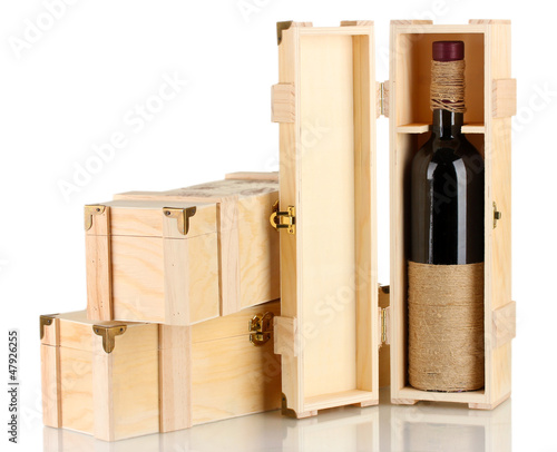 Photo: Wine bottle in wooden box, isolated on white Wine bottle in wooden box, isolated on white