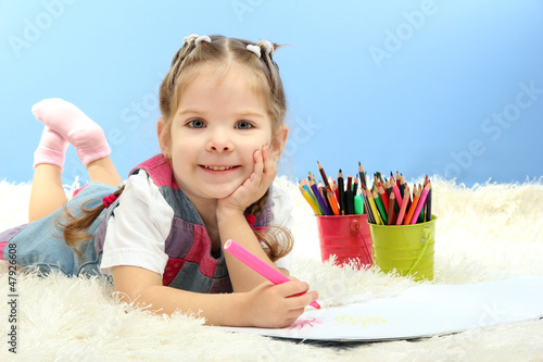 Photo: cute little girl playing with multicolor pencils, cute little girl playing with multicolor pencils,