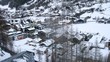 Carriage of funicular flies up over valley and houses