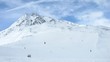Tourists go down on skis from high mountain Schwarzseekogl